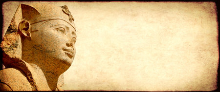 Grunge background with paper texture and face of sphinx statue. Horizontal banner with ancient egyptian sphinx in Alexandria. Copy space for text. Mock up templatの写真素材