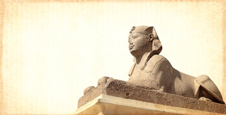 Grunge background with paper texture and sphinx statue. Horizontal banner with ancient egyptian sphinx in Alexandria. Copy space for text. Mock up templatの写真素材
