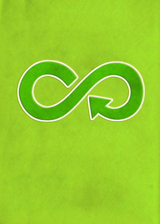 Circular economy symbol on green paper texture. Sustainable development of strategy approach to zero waste, responsible consumption, pollution. Eco-friendly, reuse, renewable resources conceptの写真素材