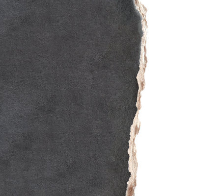 Torn paper edge. Edge of cardboard texture of black color. Copy space for text. Isolated on white backgroundの写真素材