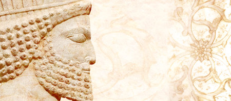 Grunge backdrop with bas-relief of face of assyrian warrior, Persepolis, Iran. Horizontal background with embossed image persian bearded man. Mock up template. Copy space for textの写真素材