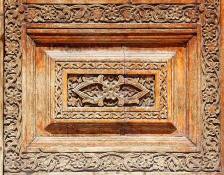Texture of vintage wood boards with carved decorative border. Vertical or horizontal retro background with old wooden planks and floral ornament. Mock up template. Copy space for textの写真素材