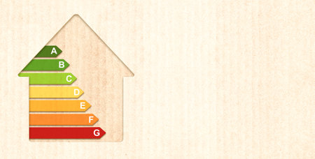 Energy efficiency chart on cardboard texture. Horizontal banner with eco paper texture and energy efficiency house symbol. Energy class, bio energetic and ecology concept. Copy space for textの写真素材