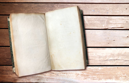Old book with blank pages on vintage boards. Vintage opened book with empty page on wood planks. Mock up template. Copy space for textの写真素材