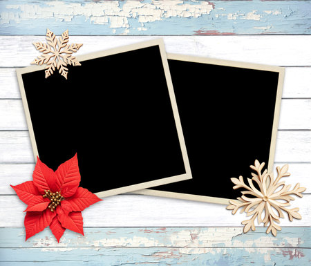 Vintage eco friendly holiday backdrop. Christmas background with two retro photo, poinsettia, snowflake on wooden boards. Copy space for text. Ecology, environmental conservation, zero waste conceptの写真素材