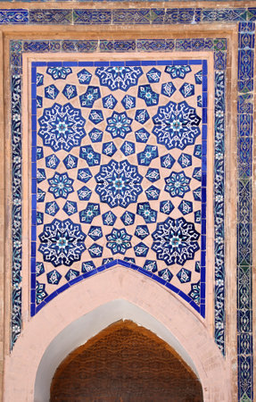 Vertical background with detail of ancient mosaic wall of Sher-dor Madrassah, Registan complex, Samarkand, Uzbekistan. Traditional iranian tile decorationsの写真素材