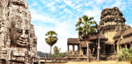 Horizontal banner with stone face in Prasat Bayon Temple. Famous landmark Angkor Wat complex, khmer culture, Siem Reap, Cambodia. Topic of vacation, travel, trip abroad on vacation, cruises and toursの写真素材