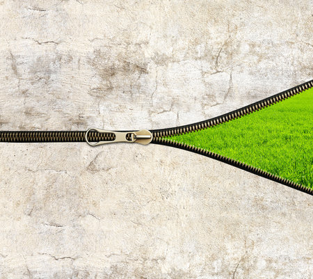 New city life concept. Concrete wall, zipper opened and green grass. Unzipped zipper or fastener. Eco-friendly, Ecology, go green, Green Energy, environmental, zero waste, responsible consumptionの写真素材