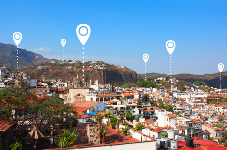 Aerial view on Taxco de Alarcon and location pin, Mexico. Planning a tourist trip. Travel way,  find trip, point navigation concept. Global positioning system pin map. Modern travel, sightsee, tourismの写真素材