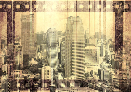 Grunge background with old paper texture, retro filmstrip frame and skyscrapers. Horizontal retro banner with film reel and urban scene. Vintage retro backdrop with paper texture and metropolisの写真素材