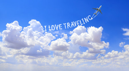 Blue sky with aircraft and Jet trailing smoke. Horizontal banner with airplane drawing a word I love traveling in sky. Topic of summer holiday, travel, trip abroad on vacation, cruises and toursの写真素材