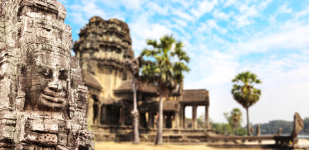 Horizontal banner with stone face in Prasat Bayon Temple. Famous landmark Angkor Wat complex, khmer culture, Siem Reap, Cambodia. Topic of vacation, travel, trip abroad on vacation, cruises and toursの写真素材