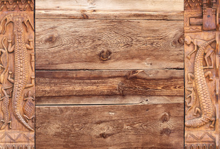 Horizontal background with wood carving frames with traditional moroccan wood carving with animals - crocodile, turtle. Ancient decorative carved border on wooden surface. Copy space for textの写真素材