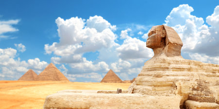 Famous Great Sphinx and pyramid of Chephren, Cheops, Menkaure, Cairo, Egypt. Great Pyramids and statue of Sphinx, Giza Necropolis. Topic of vacation, travel, trip abroad on vacation, cruises and toursの写真素材