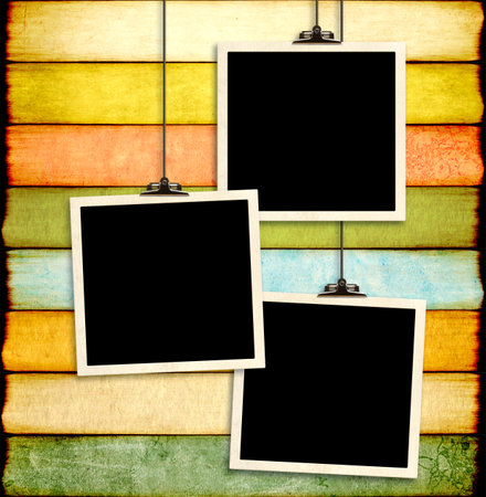 Retro Photo hanging on paper clip on paper backdrop. Nostalgic Picture album with old photoframes for cherished memories, creating a unique display. Moodboard pictures album. Vintage style mood boardの写真素材