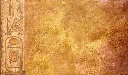 Horizontal background with ancient Egyptian hieroglyphs on stone wall, Egypt, Africa. Backdrop with sandstone carving with hieroglyph. Copy space for textの写真素材