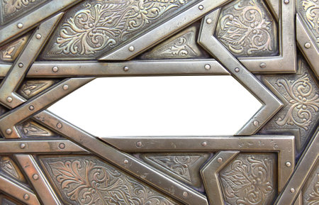 Frame with traditional islamic ornament. Antique copper backdrop and national moroccan floral pattern. Oriental ornaments with artistic with chasing for brass. Copy space for text. Isolated on whiteの写真素材