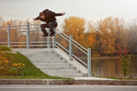 Young Skateboarder doing a Ollie down the stairsの写真素材