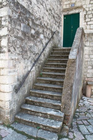 Old stone stairs, wall and doorの写真素材