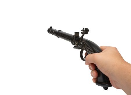 Hand with aimed old gun.  Isolated on white,