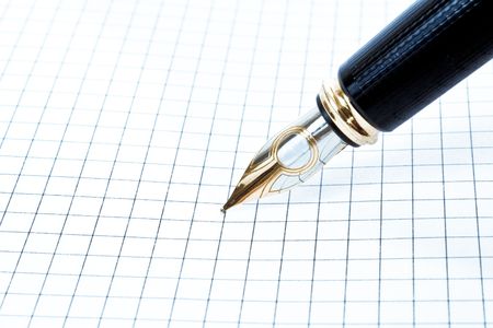 Blank grid paper with penの写真素材