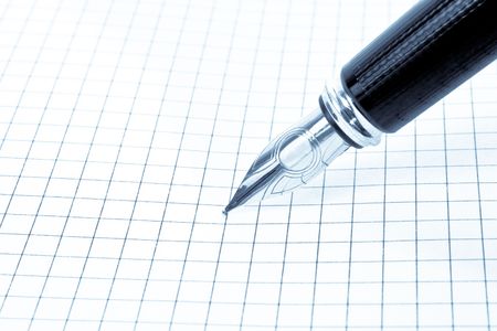 Blank grid paper with penの写真素材