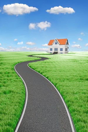 Road to House on green meadoの写真素材