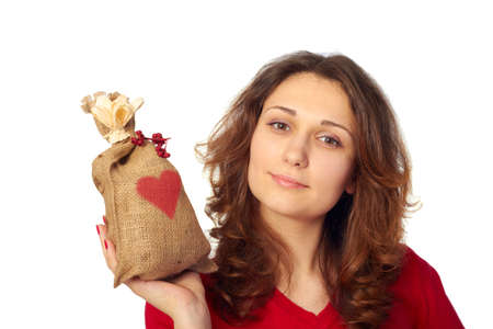 Young Woman holding a gift bag with a red heart on itの写真素材