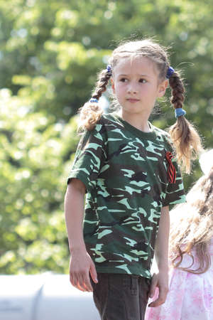 KHARKIV, UKRAINE - MAY 09: Children on  military equipment of Victory Day on Freedom Square on May 09, 2012 in Kharkiv, Ukraine.のeditorial素材