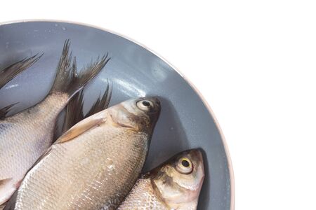 Fish fry in a frying pan  Isolated on white