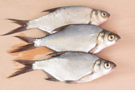 Fish fry on a wooden board  Isolated on whiteの写真素材