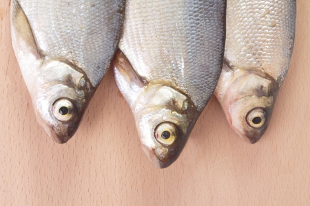 Fish fry on a wooden board  Isolated on whiteの写真素材