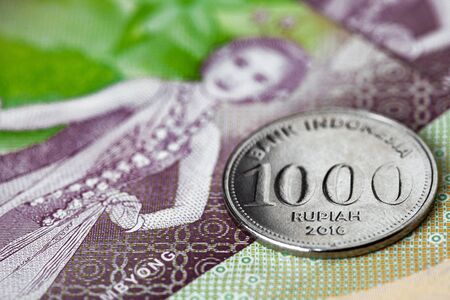 Indonesian rupiah coin and bills close up