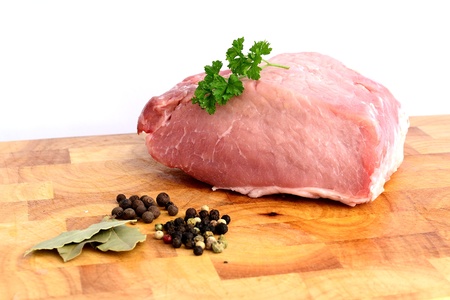 Pork meat on wooden cutting boardの写真素材