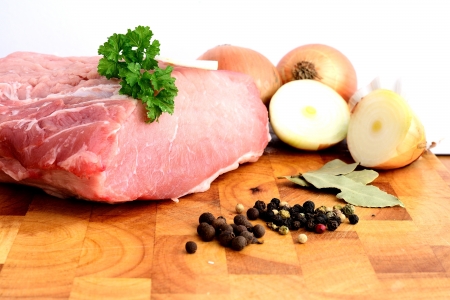 Fresh pork on wooden cutting boardの写真素材