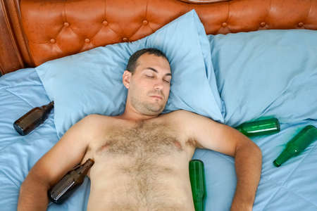 Drunk Man Sleeping, view from top shot with a Sony A6300の写真素材