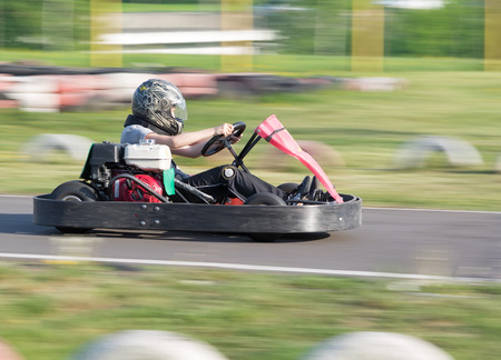 The child participates in race on a go-cart in carting clubのeditorial素材