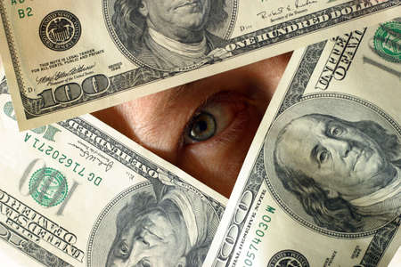 The image of 300 dollars and man's eye in middleの写真素材