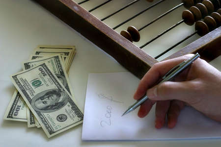 The man writes on a paper of figureの写真素材