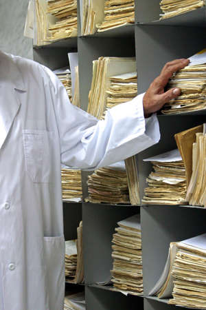 Man's hand and file of a card