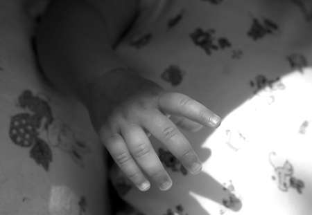 The image of a children's hand. Black-and-whiteの写真素材