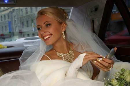 The beautiful bride in the automobile. The happy Bride.の写真素材