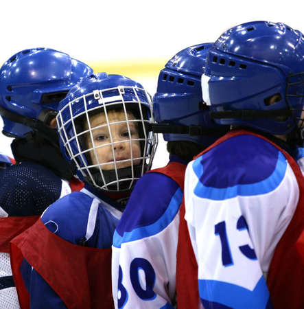 Portrait of the young hockey player in the dark blue formの写真素材