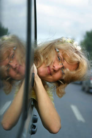 Smiling girl in the automobile