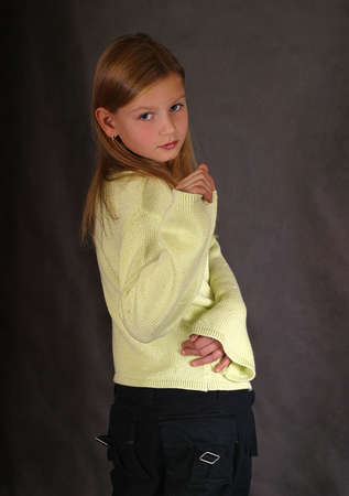 The beautiful girl in a yellow sweaterの写真素材