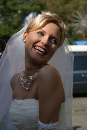Beautiful smiles of the bride of the blonde. The happy Bride.の写真素材