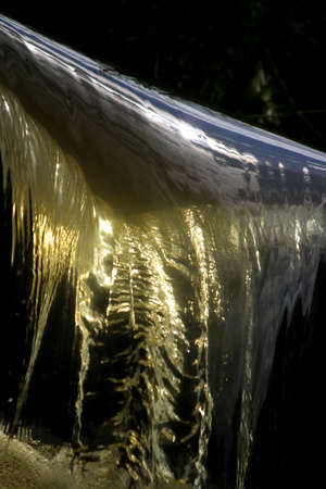 The image of a falls with reflectionの写真素材