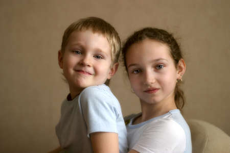 Portrait of the brother and the sister in home conditions