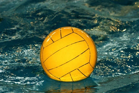 The image of a yellow ball on waterの写真素材