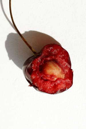 Half of berry of a sweet cherry on a white backgroundの写真素材